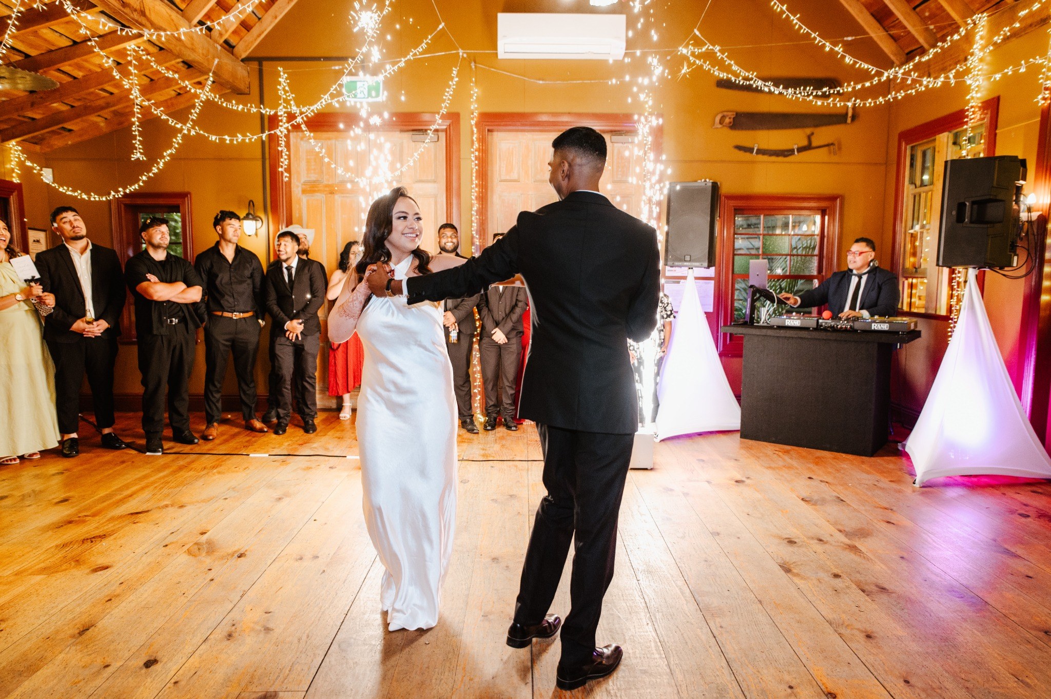 Newlyweds sharing their first dance at a real DJ Ray wedding